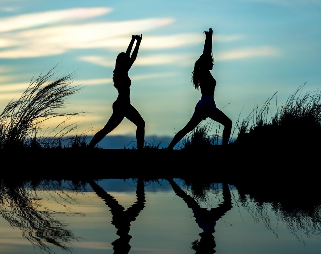 women, yoga, silhouettes, water, reflection, mirroring, water reflection, pose, posing, yoga pose, meditation, stretching, wellness, well-being, exercise, adults, asia, nature, girls, morning, outdoors, pair, people, stance, sunrise, sunset